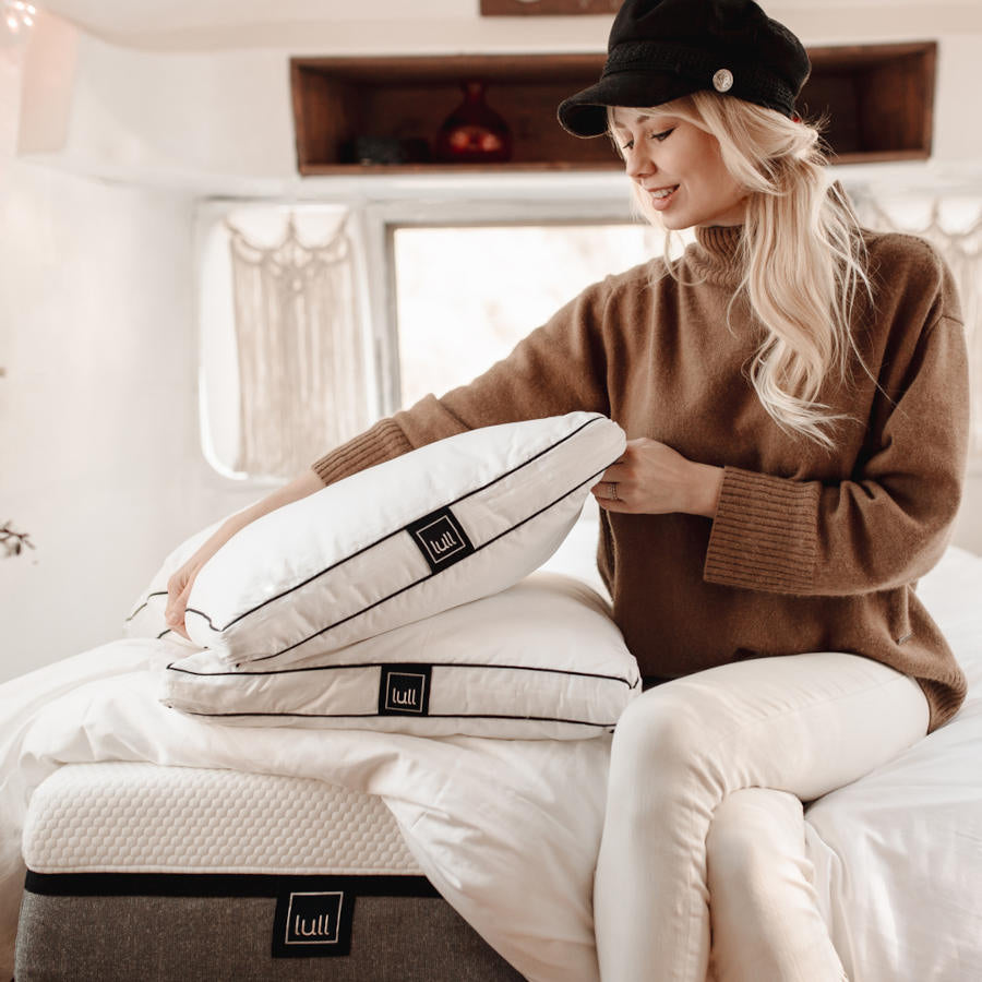 woman with bedding bundle