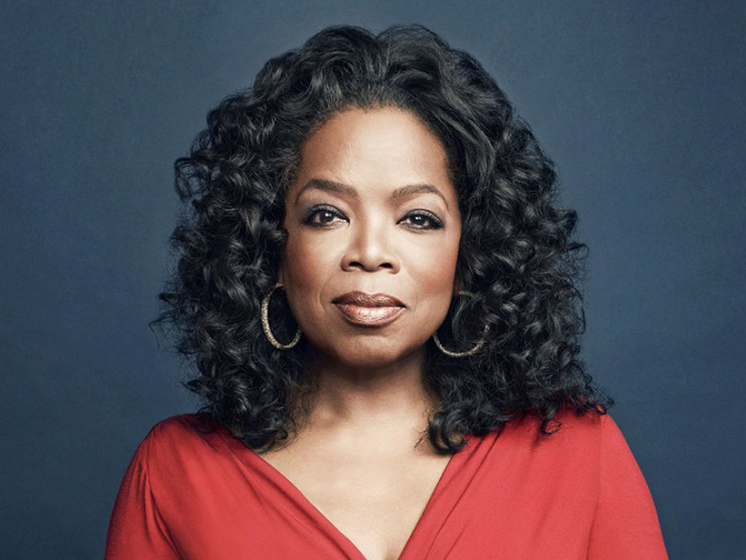 Oprah Winfrey in a red dress.