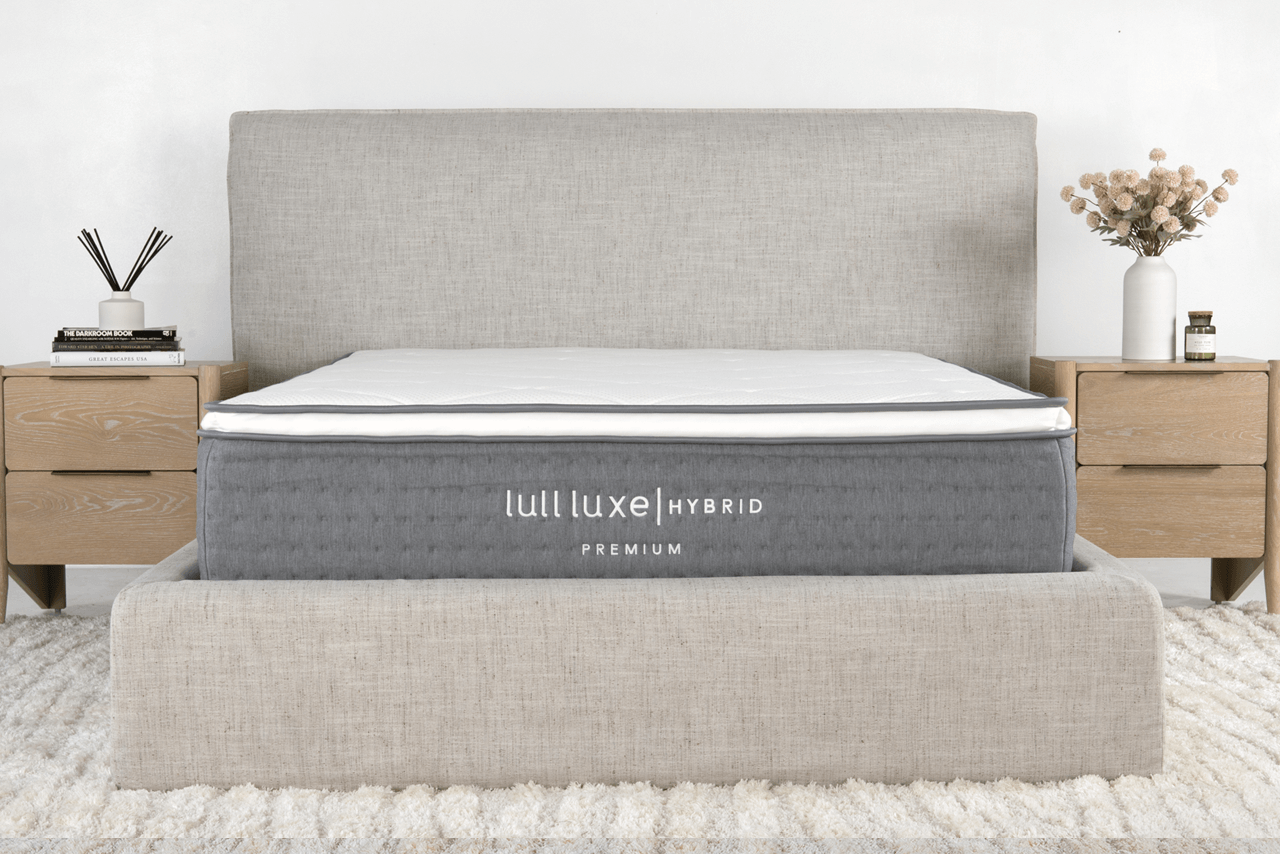 A picture of a Lull mattress with two night stand tables.