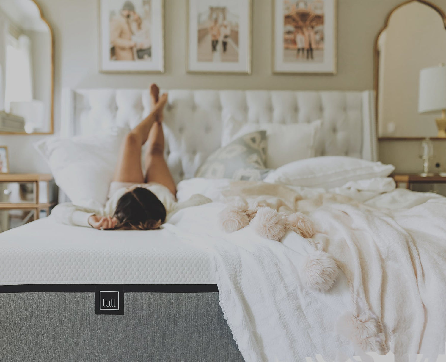 A picture of a woman lying on her back on a lull mattress with her feet on a headboard.