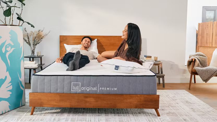 A couple looking very comfortable on top of a lull original premium mattress.