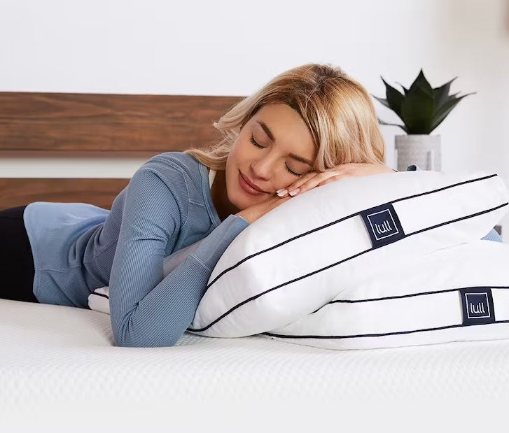 Woman sleeping on Lull Down Pillow