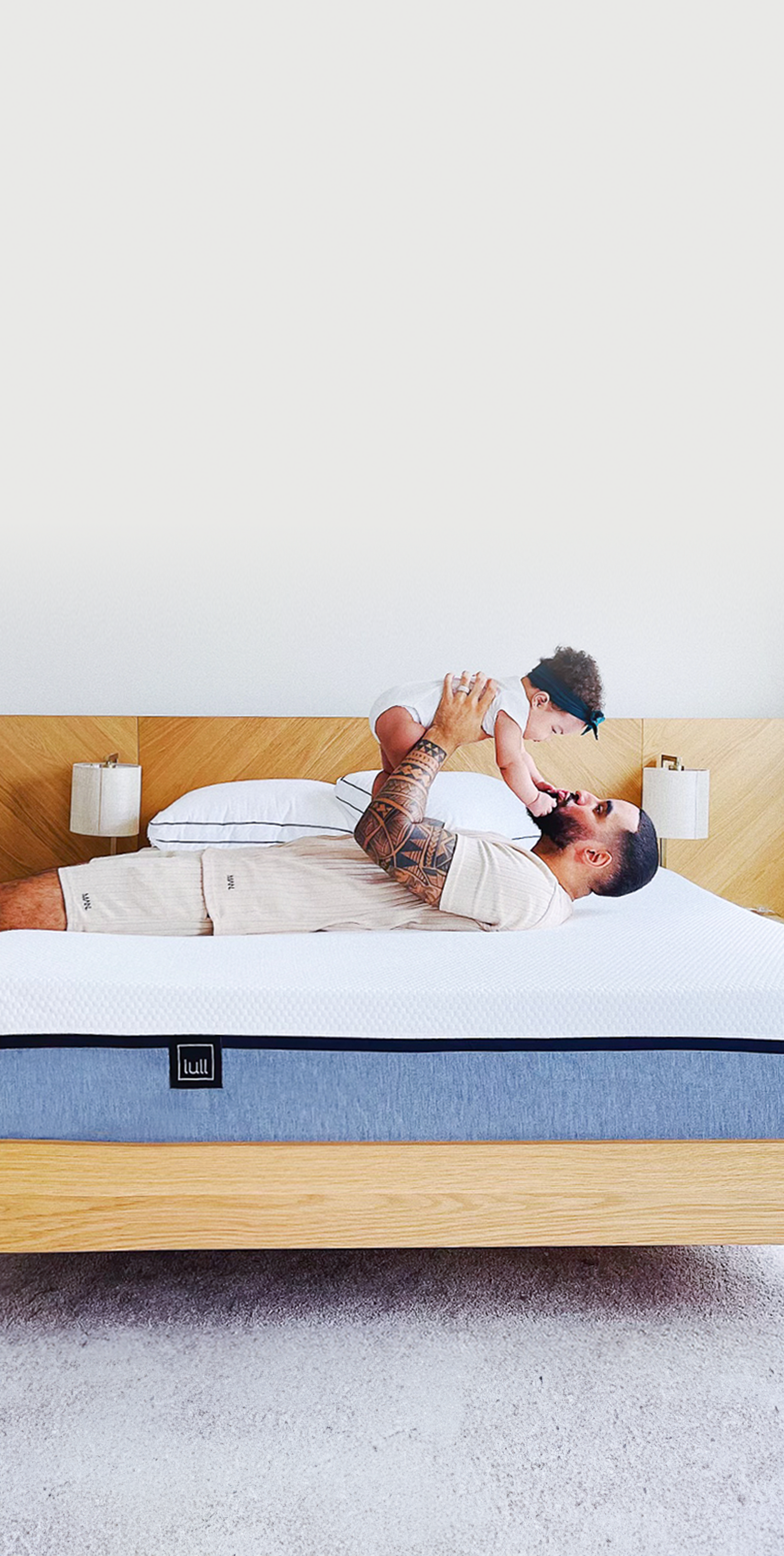 A man with baby on lull mattress.