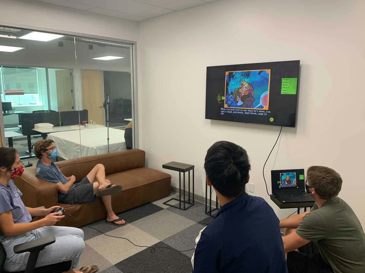 A few lull employees playing video games in a lull conference room.