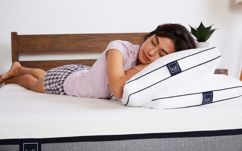 Woman sleeping on Lull pillows